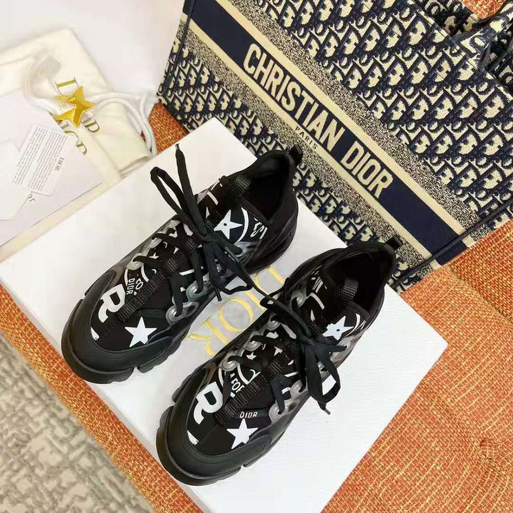 Close-up of Dior Union print detail on black fabric sneaker