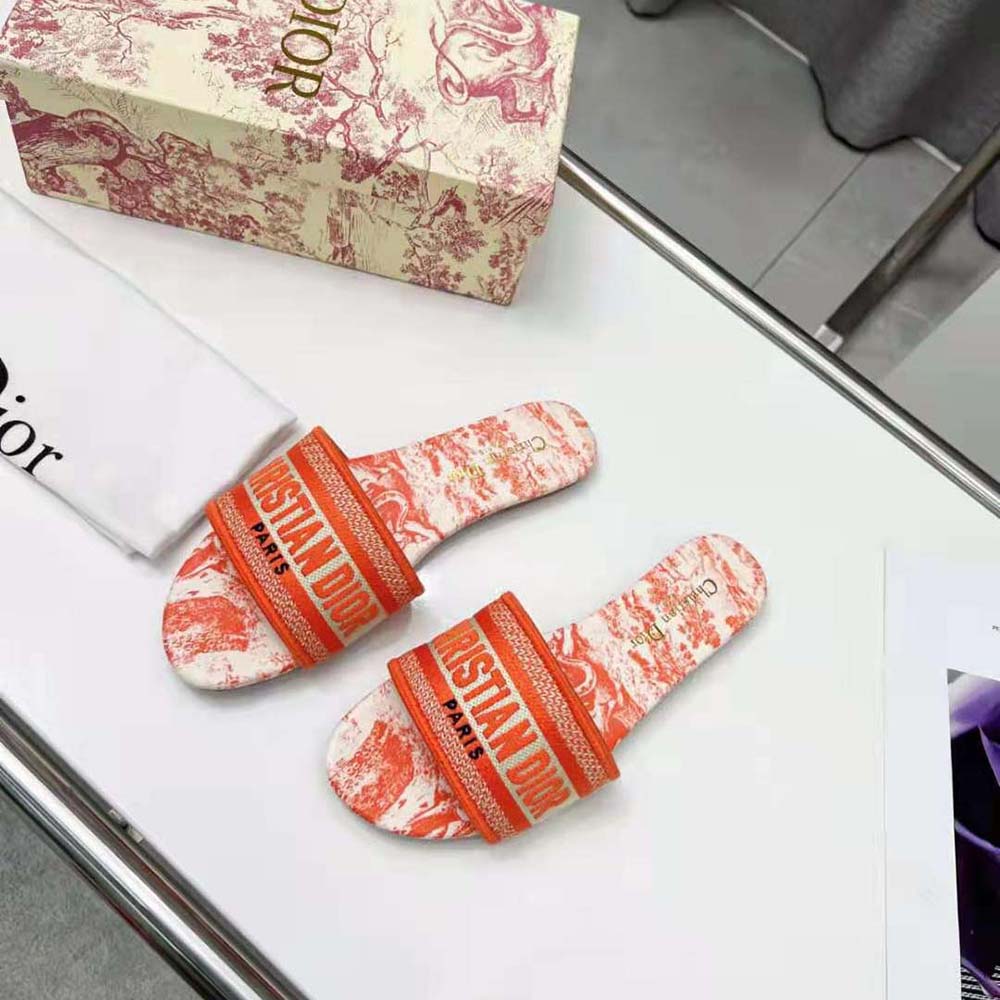Side angle showing silver-tone logo on Dior Women Dway Slide Bright Orange Toile De Jouy Embroidered Cotton