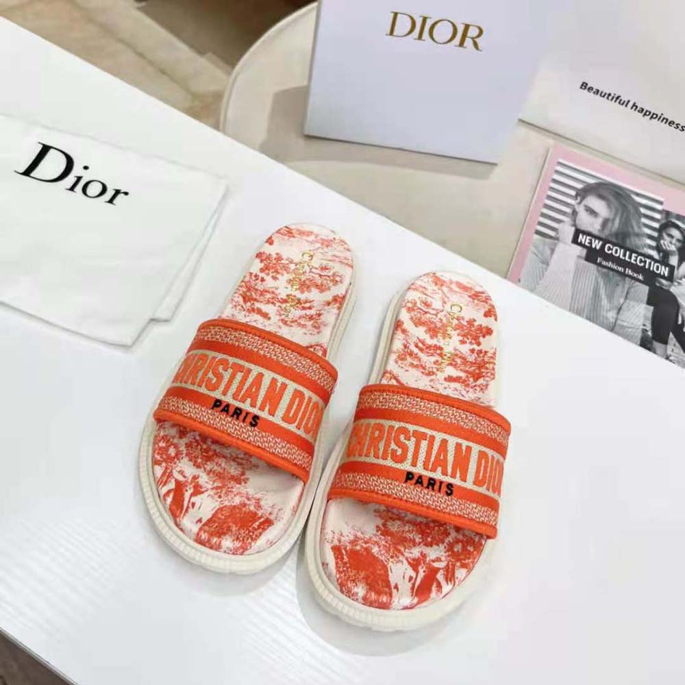 Close-up of vibrant orange Toile de Jouy embroidery on Dior Women Dway Slide sandal