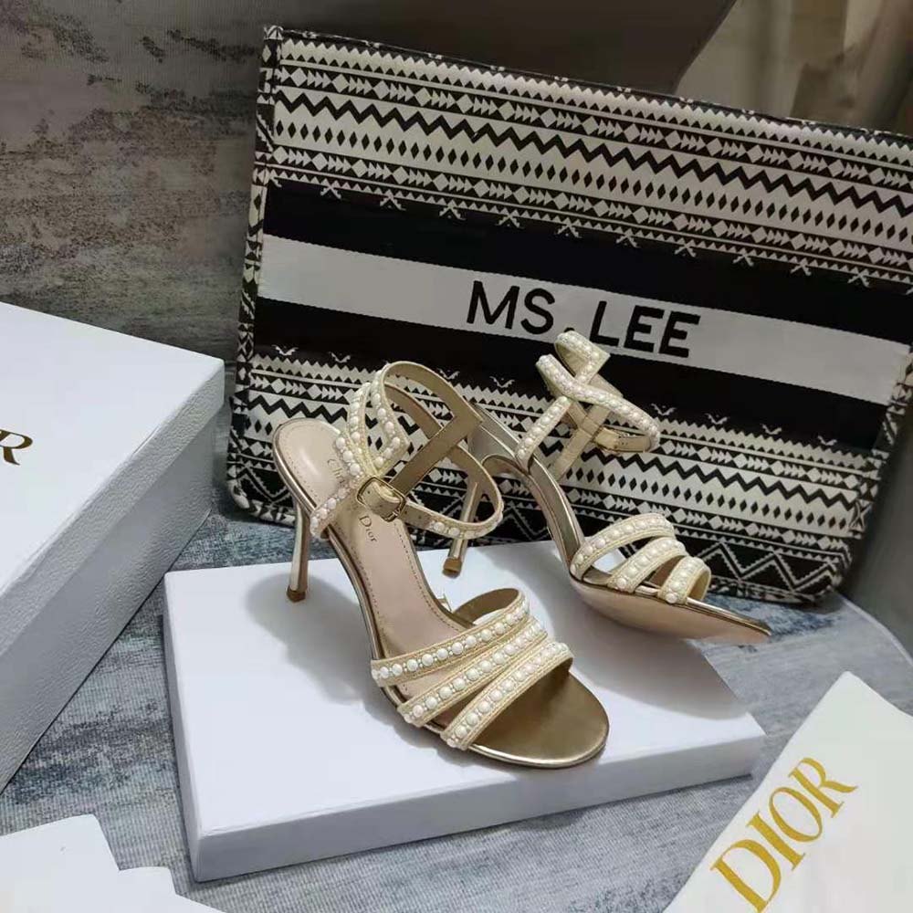 Close-up of gold-tone metallic thread and white beads on Dior Women Gem Heeled Sandal