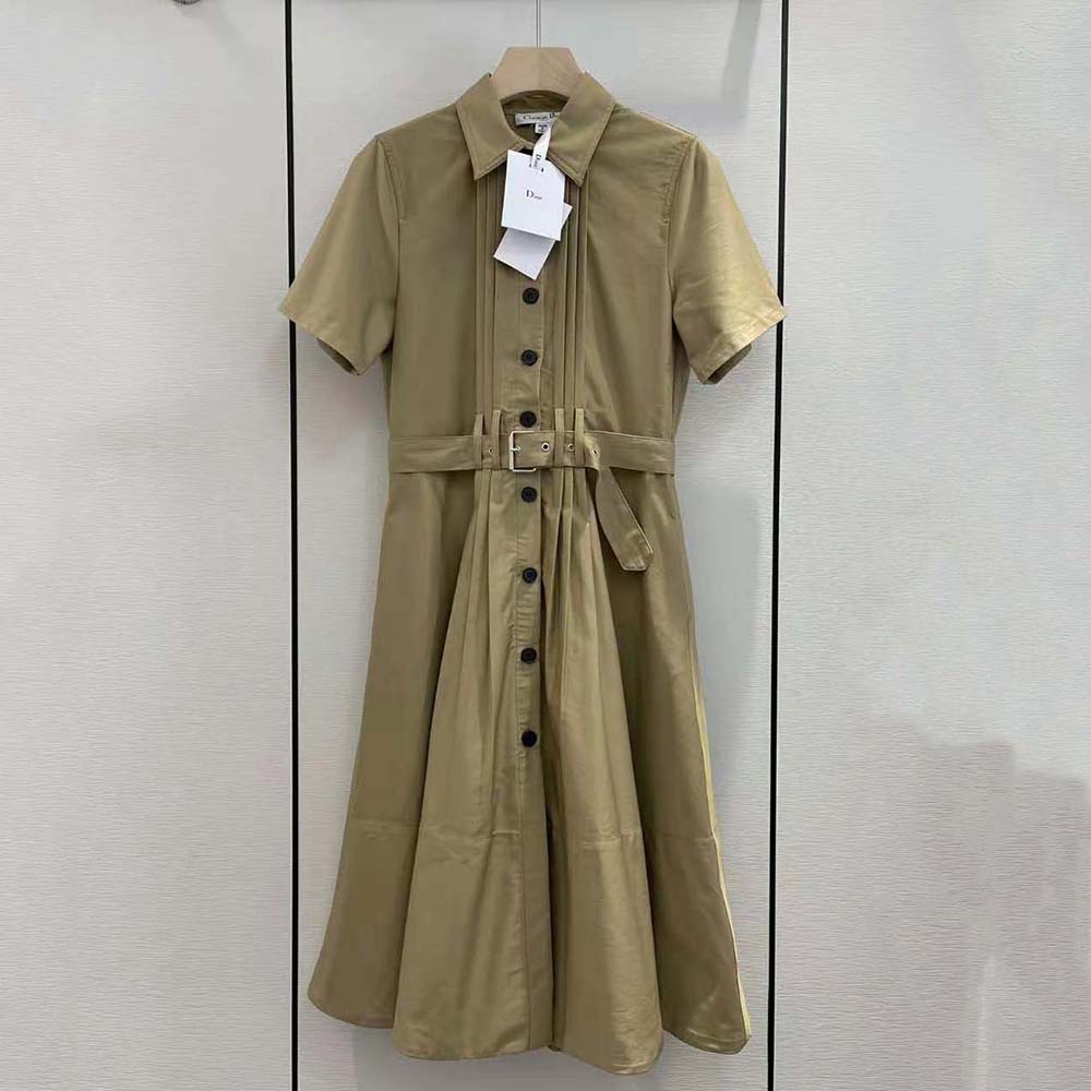 Close-up of pleated skirt and belted waist on Dior dress
