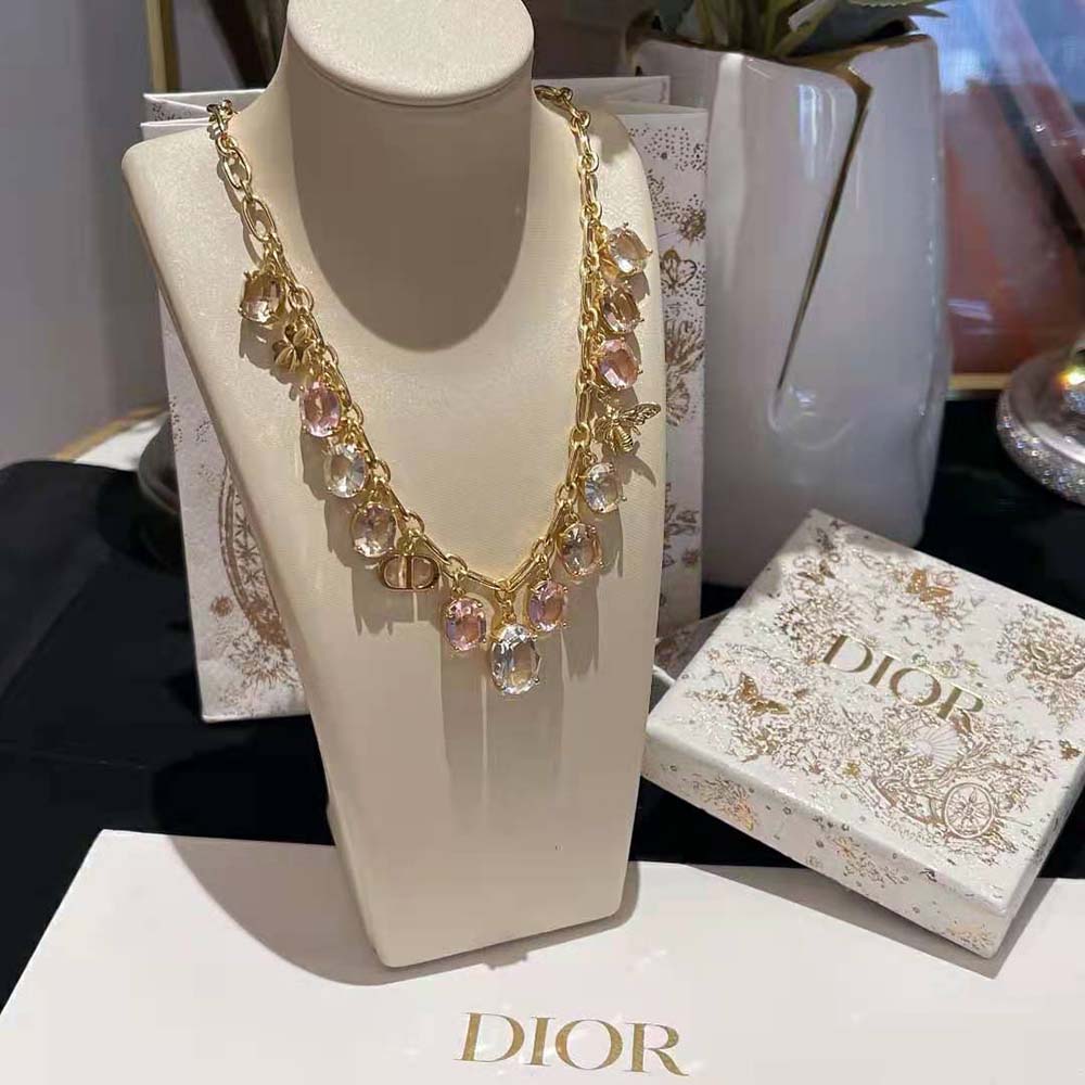 Close-up of white resin pearl and multicolor crystals on Dior necklace
