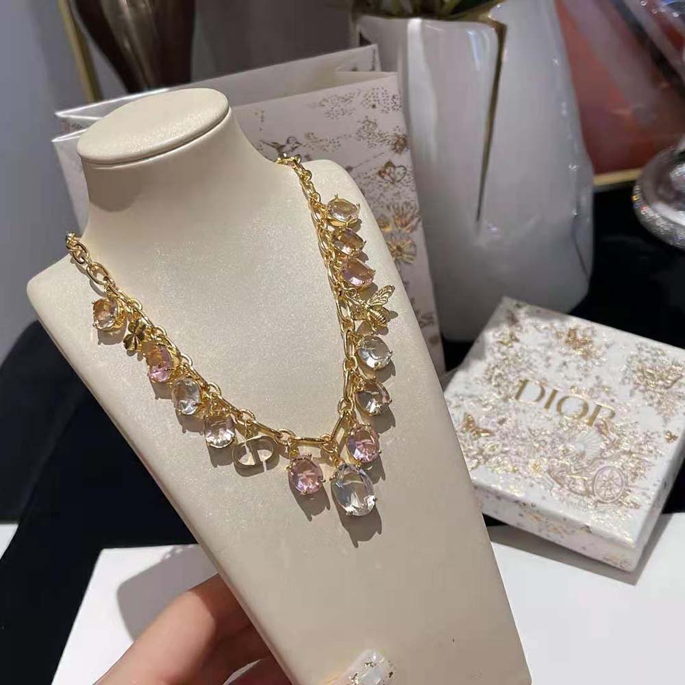 Side angle highlighting lobster clasp and gold-finish metal of Dior necklace