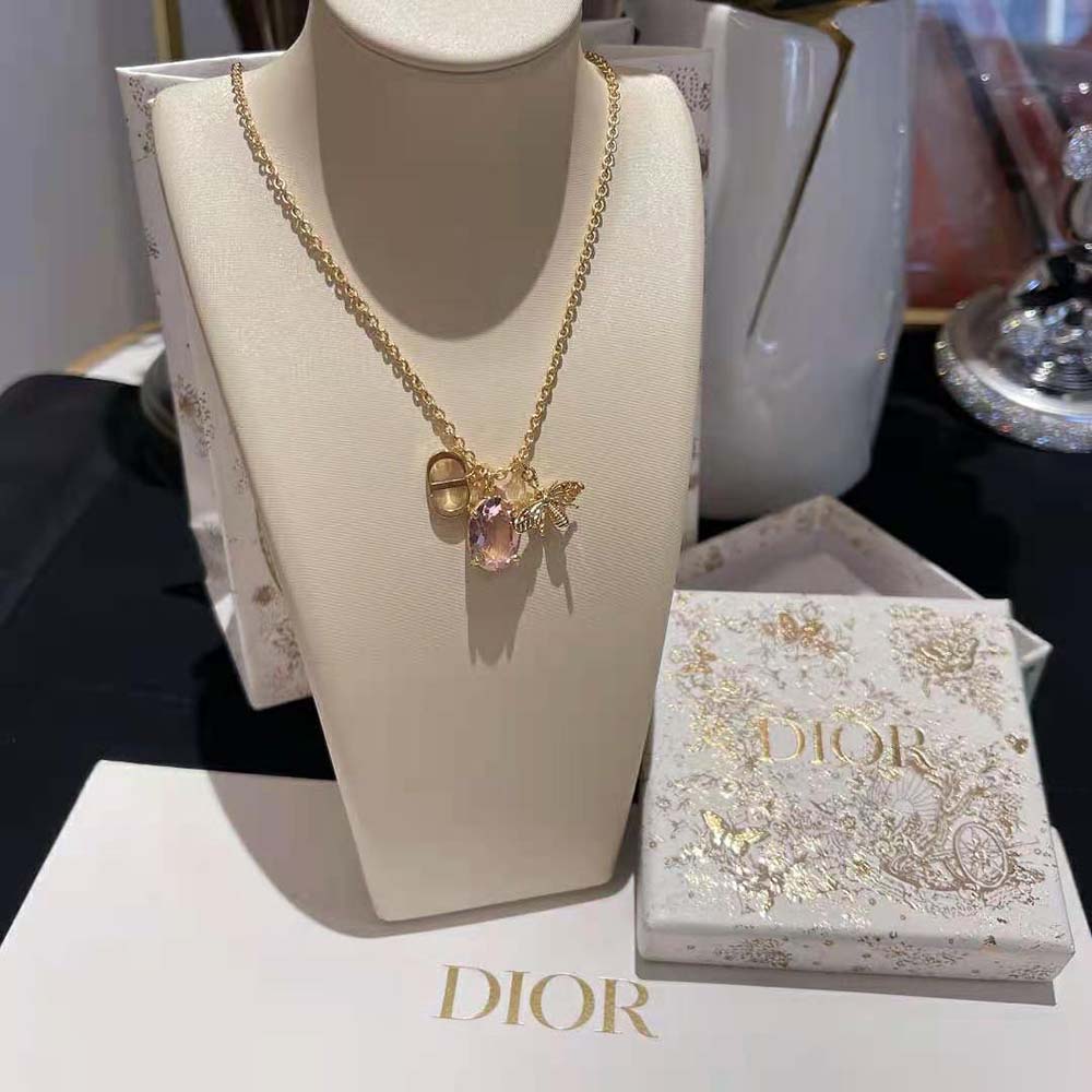 Dior Women Petit CD Necklace showing white resin pearl and amber crystal