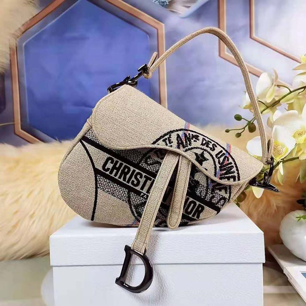 Close-up on Dior Union embroidery detail on Dior Women Saddle Bag Beige Jute Canvas