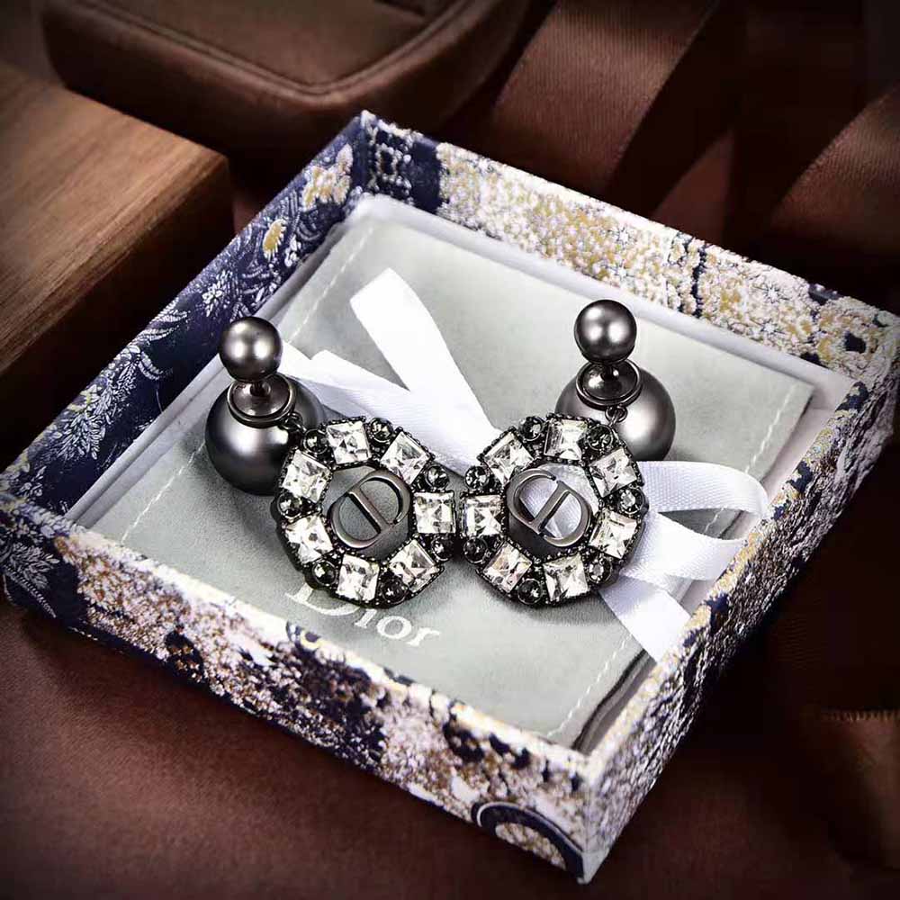 Side angle showing double-sided silhouette of Dior Women Tribales Earrings