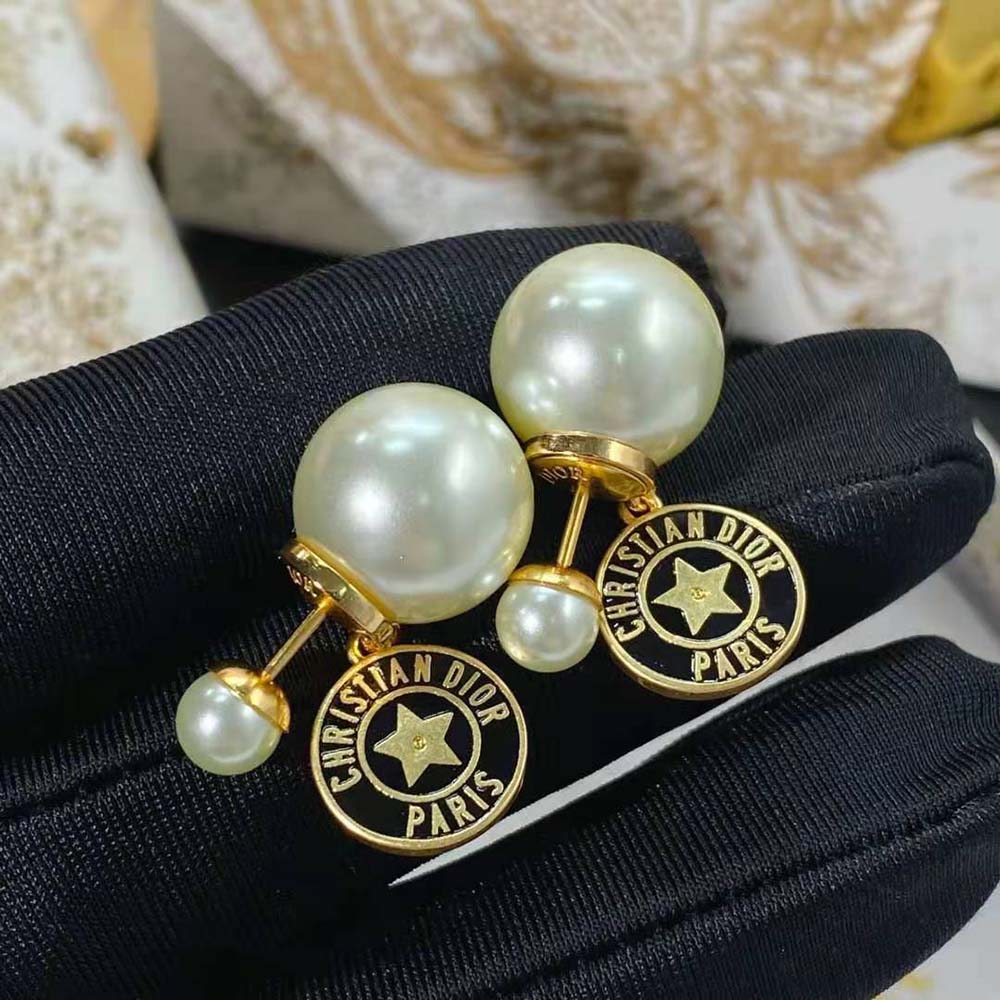 Close-up showing white resin pearls and navy blue lacquer detail