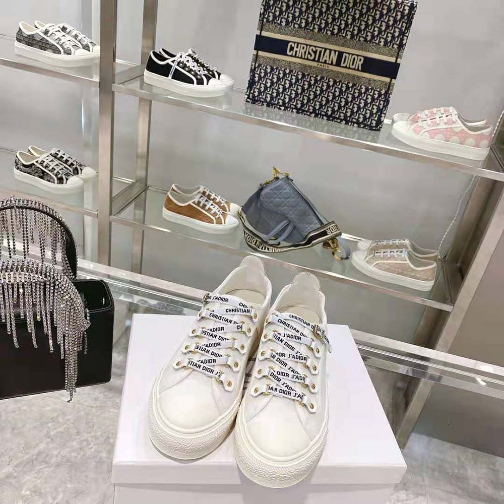 Top view showing laces and orange leather details on Dior Women Walk N Dior Sneaker