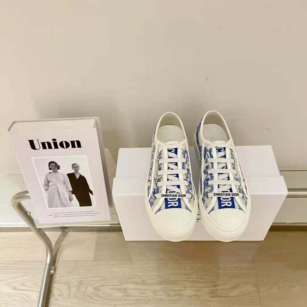 Close-up detail of blue Toile de Jouy embroidery on Dior Women Walk’N’dior Sneaker