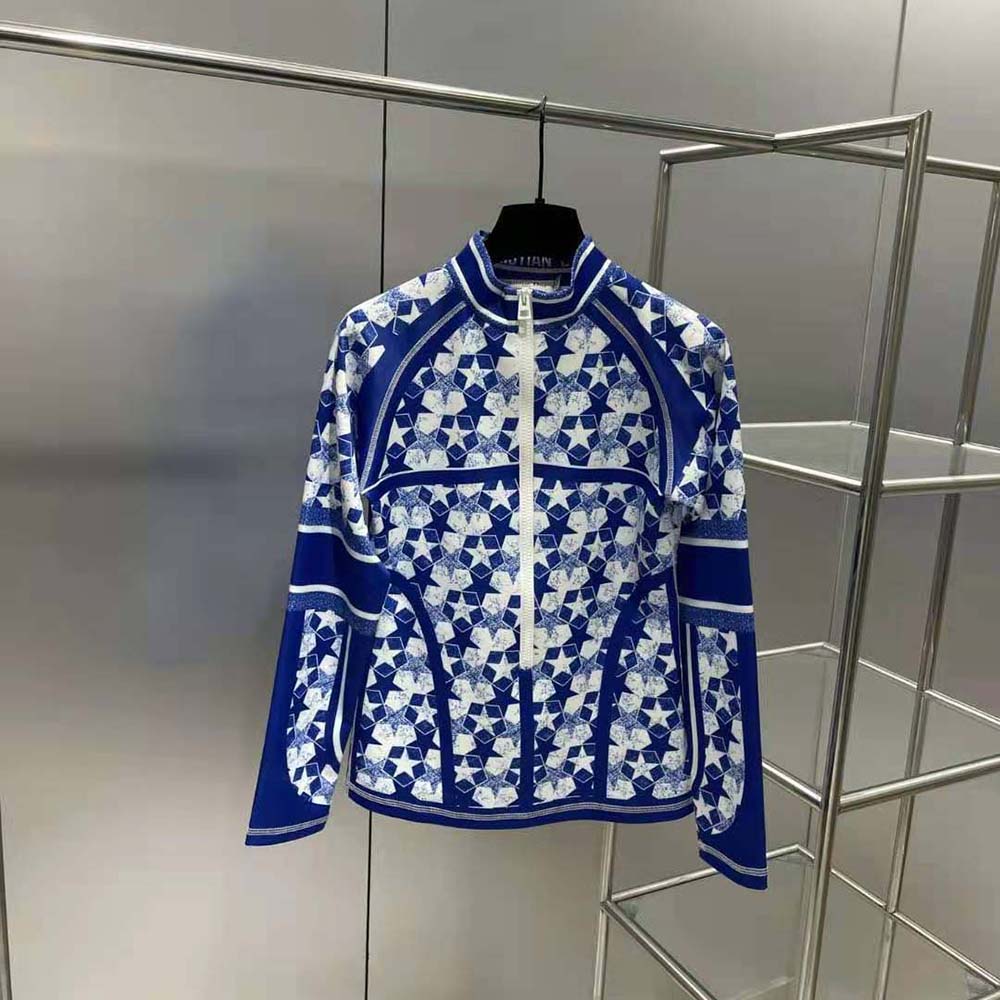 Close-up of silver zipper and Dior Étoile emblem on jacket