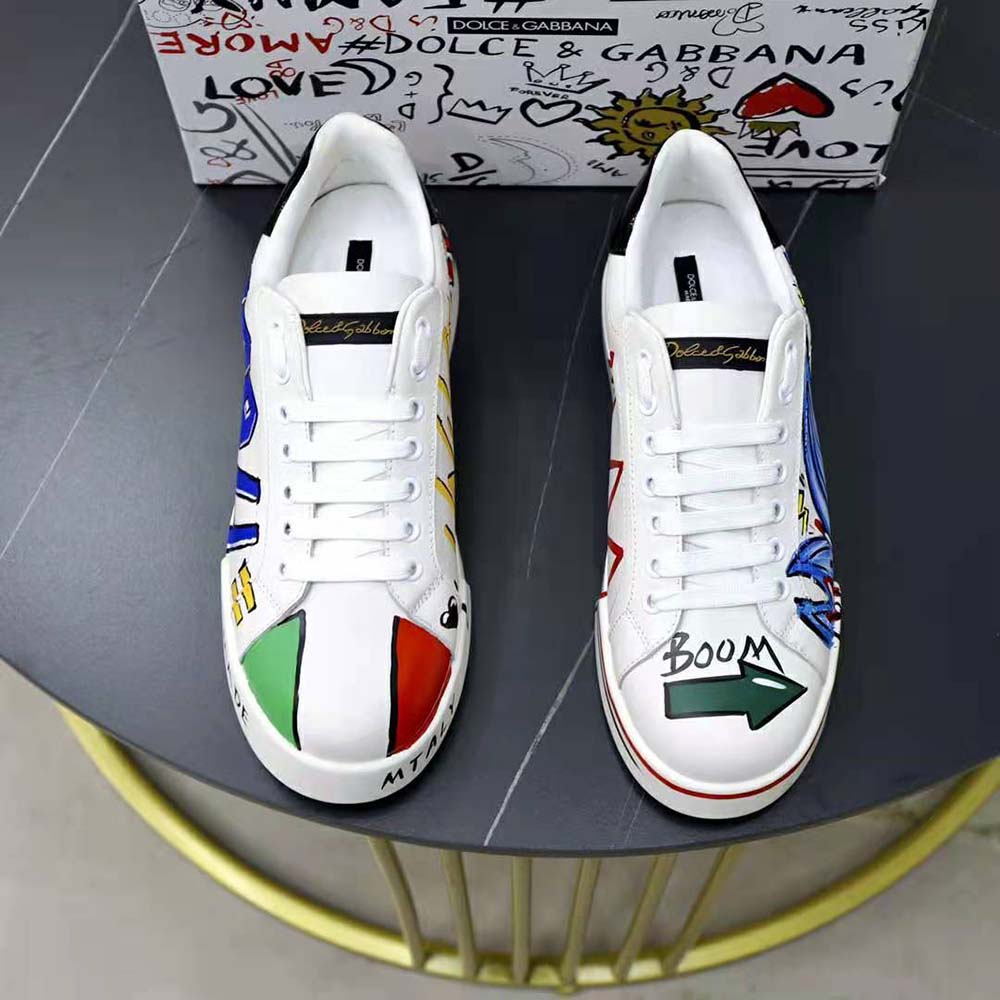 Close-up of blue leather and D&G logo metal detail on Portofino Sneakers