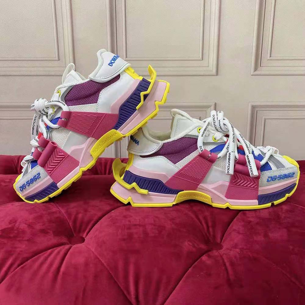 Close-up of purple mixed materials and D&G logo on sneakers