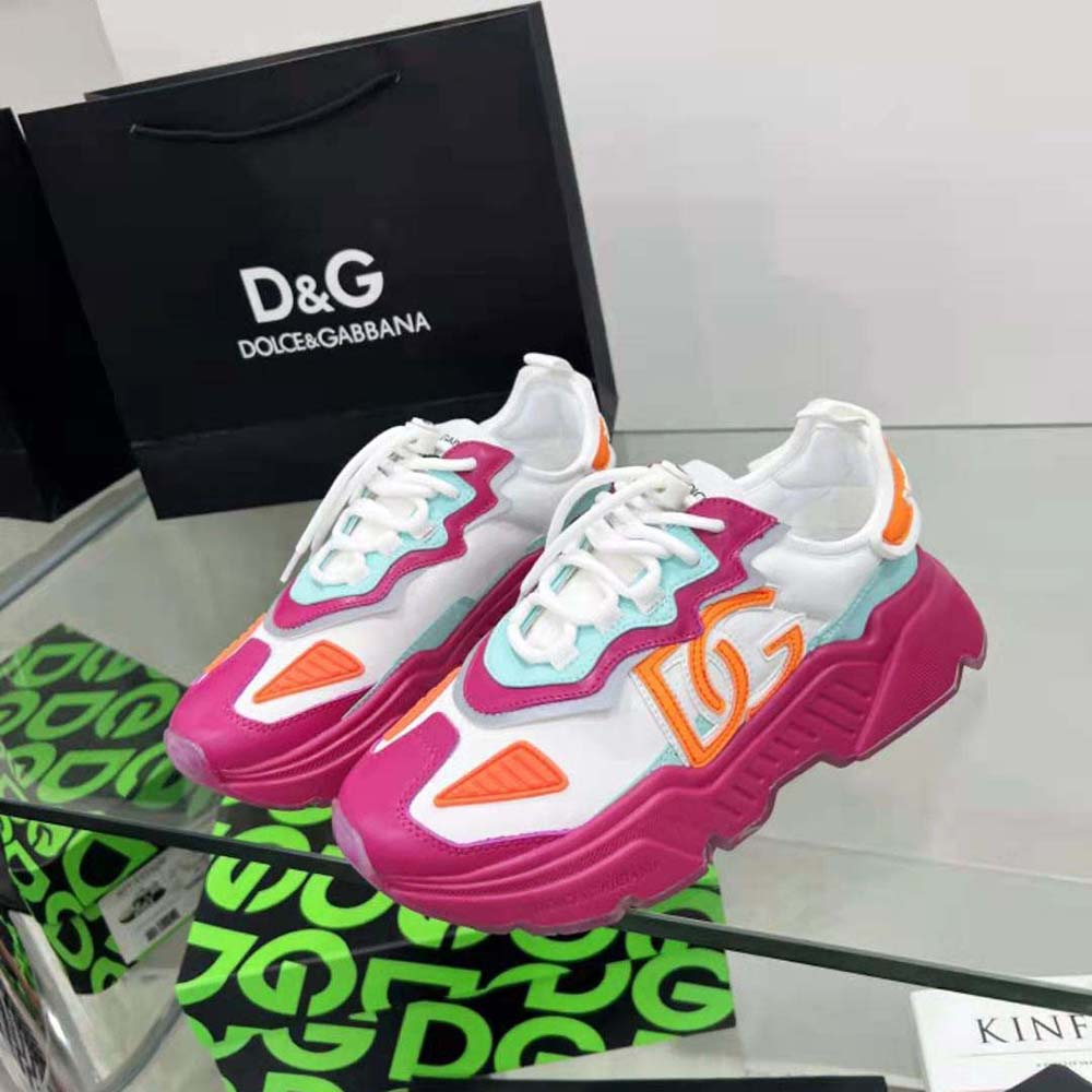 Top-down angle showcasing pink mesh and logo hardware on Daymaster Sneakers