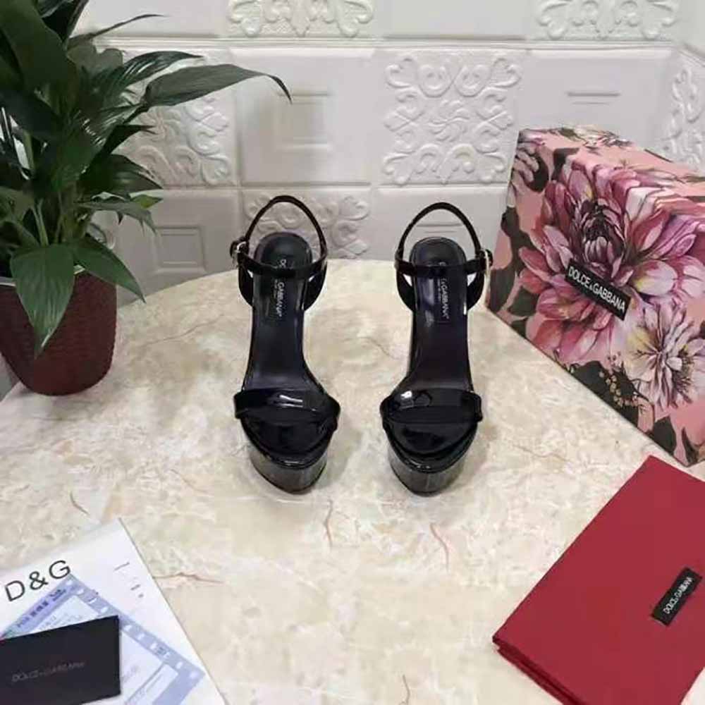 Close-up on gold D&G logo hardware of polished calfskin platform sandals
