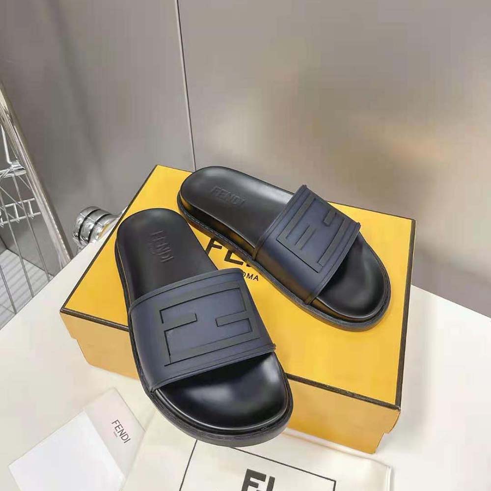 Top-down angle showing open-toe design of Fendi Men Baguette Slides