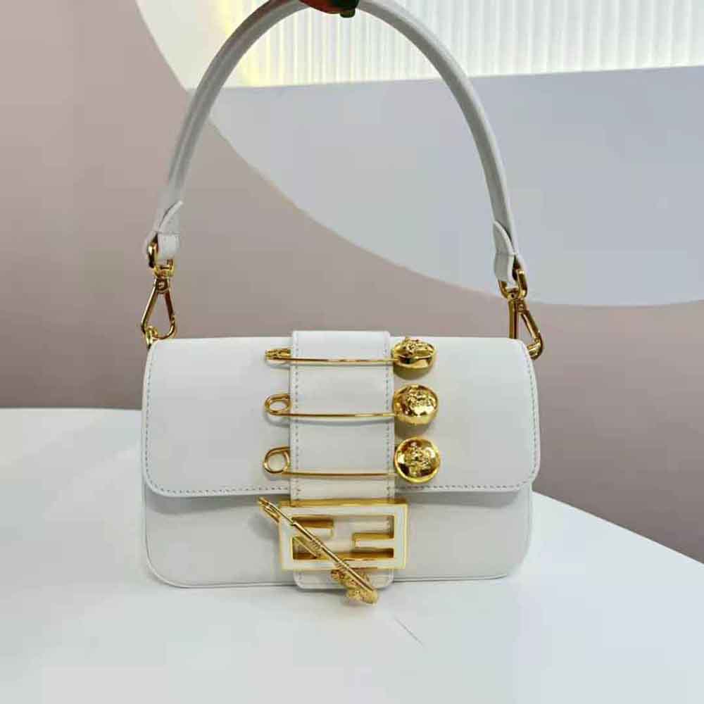 Close-up of gold brooch detail on Fendi Women Brooch Mini Baguette Fendace White Leather Bag