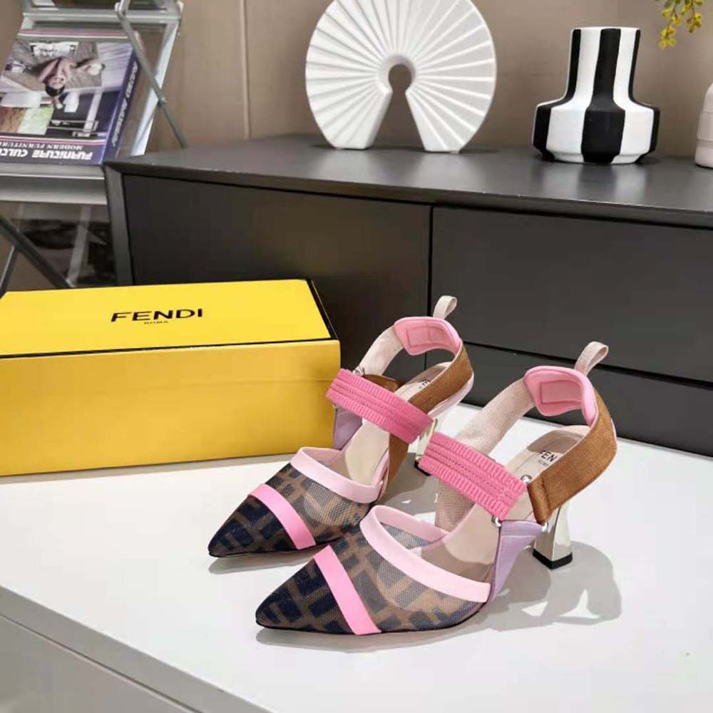 Close-up of gold Fendi logo hardware on brown mesh slingbacks