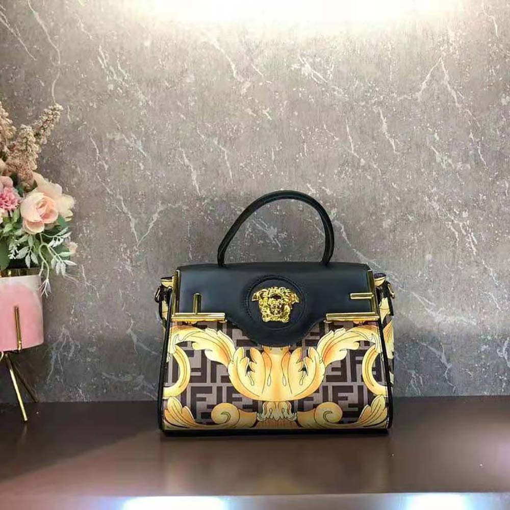Side angle showing smooth black leather and structured silhouette of Fendi Women Fendace La Medusa Medium Handbag-Black
