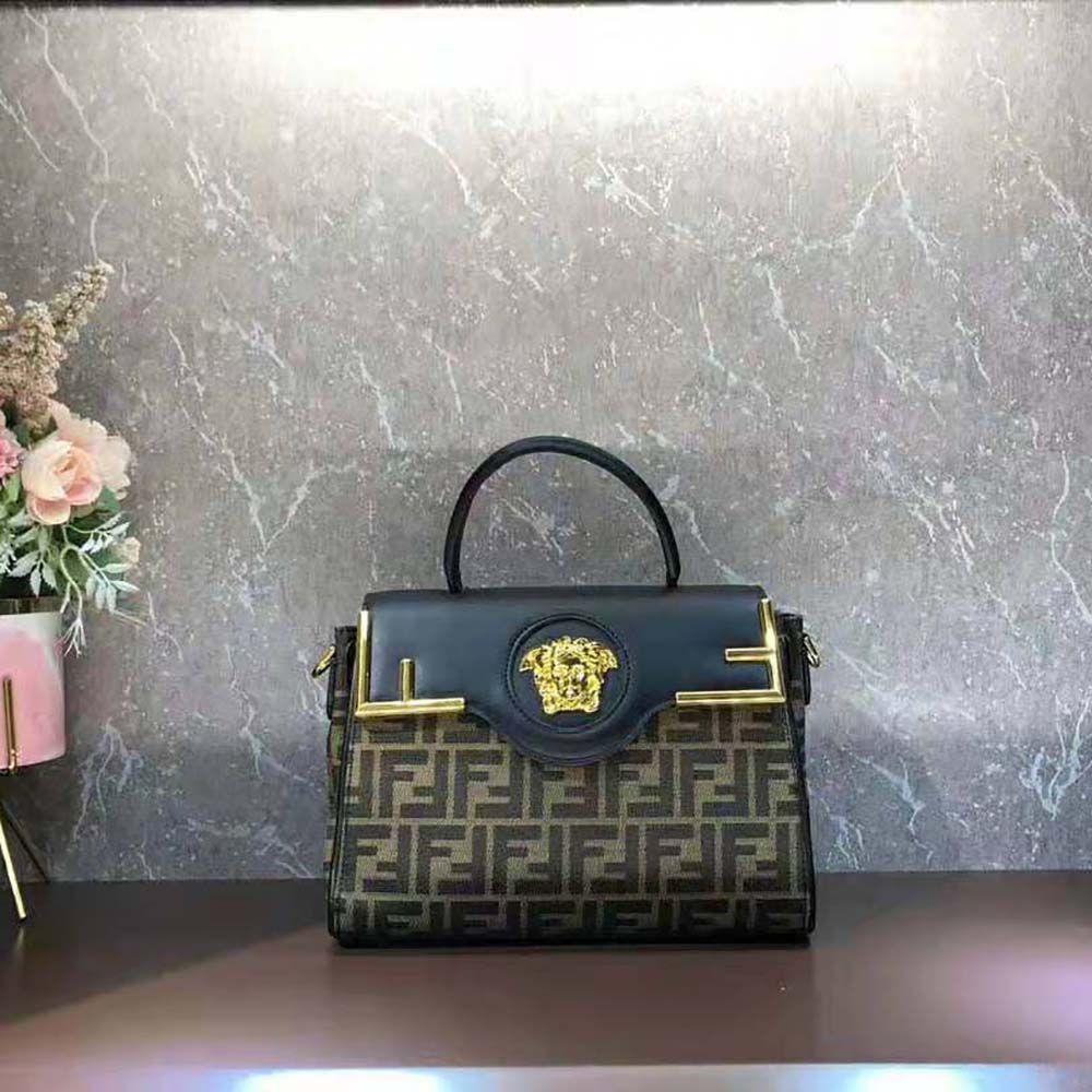 Side angle showing structured silhouette of Fendi Women Fendace handbag