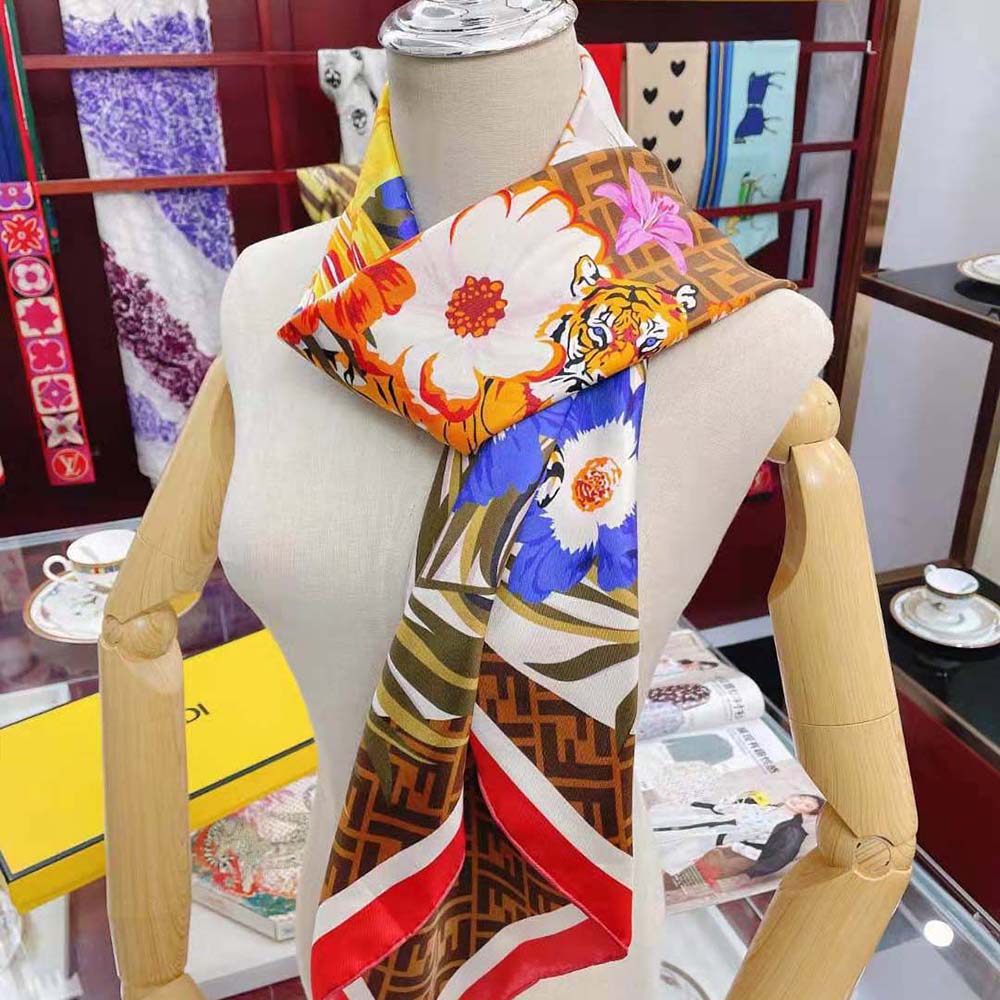 Fendi Women Flower Foulard Foulard styled folded on wooden surface