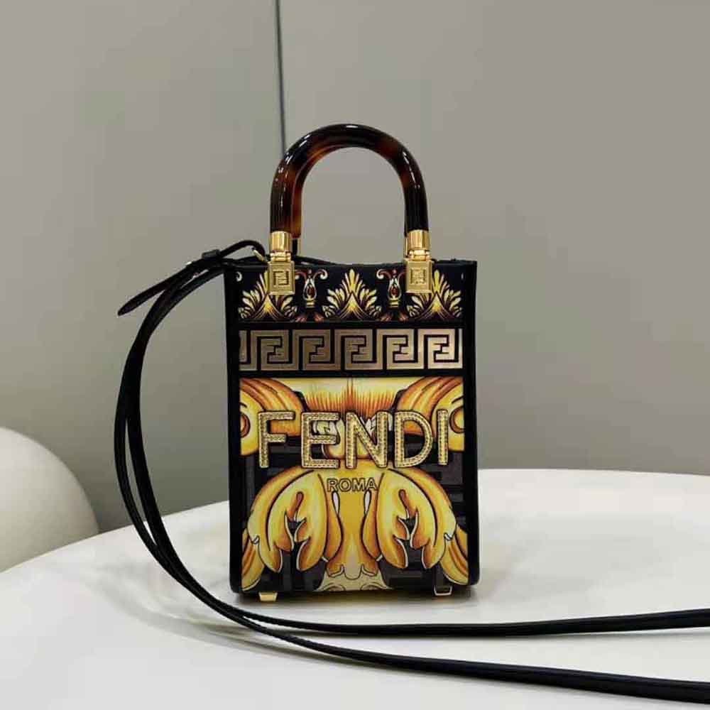 Close-up of gold-tone hardware and printed FF on Fendi Women Mini Sunshine Shopper bag