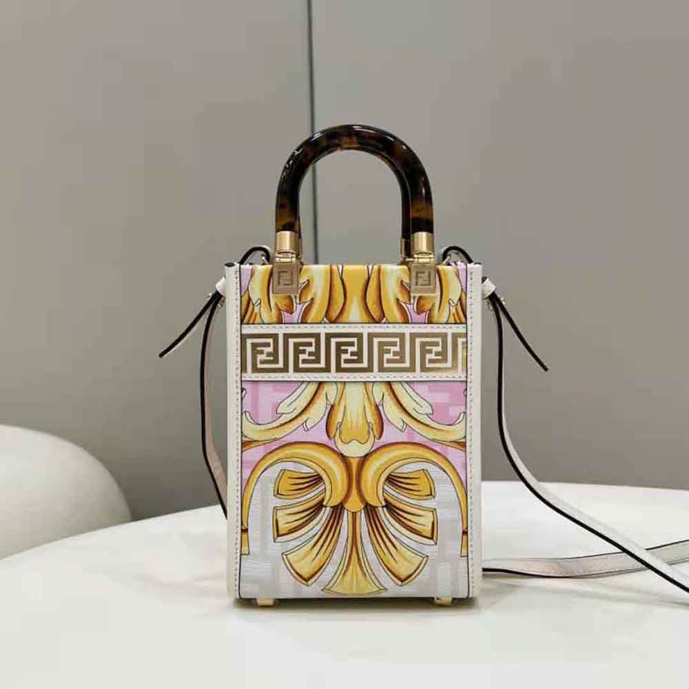 Close-up of gold-tone hardware on Fendi Women Mini Sunshine Shopper bag