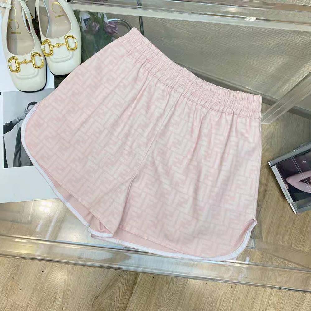 Close-up of rounded hem detail on Fendi pink denim shorts