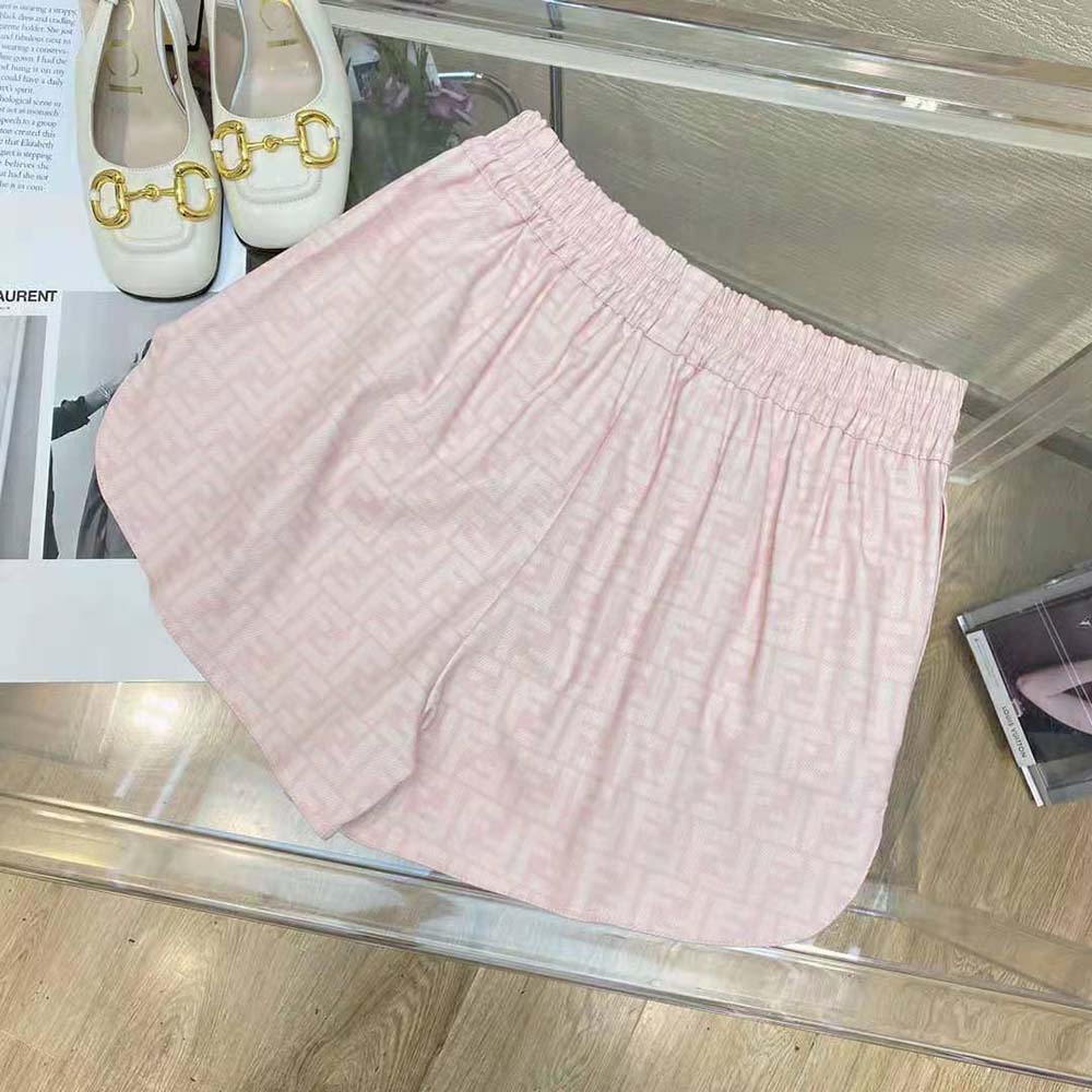 Side angle showing zip and button closure on Fendi pink shorts