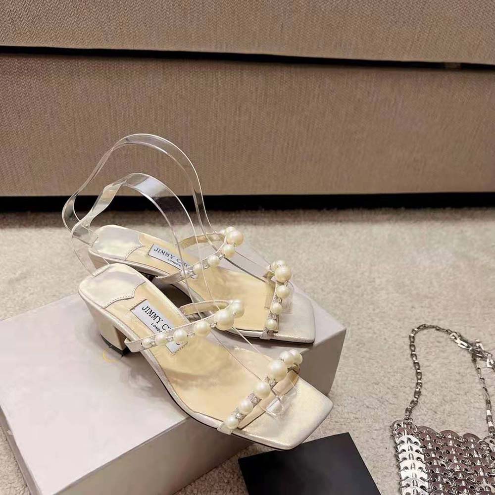 Back view showing 45mm heel of Jimmy Choo Women Amara Champagne Shimmer Suede Mules