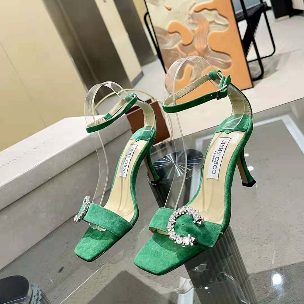 Close-up of Jimmy Choo Marsai 90 green suede and crystal buckle detail