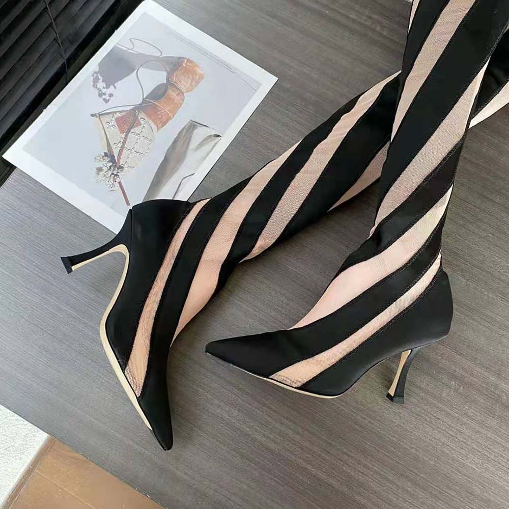 Side view highlighting heel and over-the-knee silhouette of Jimmy Choo boots