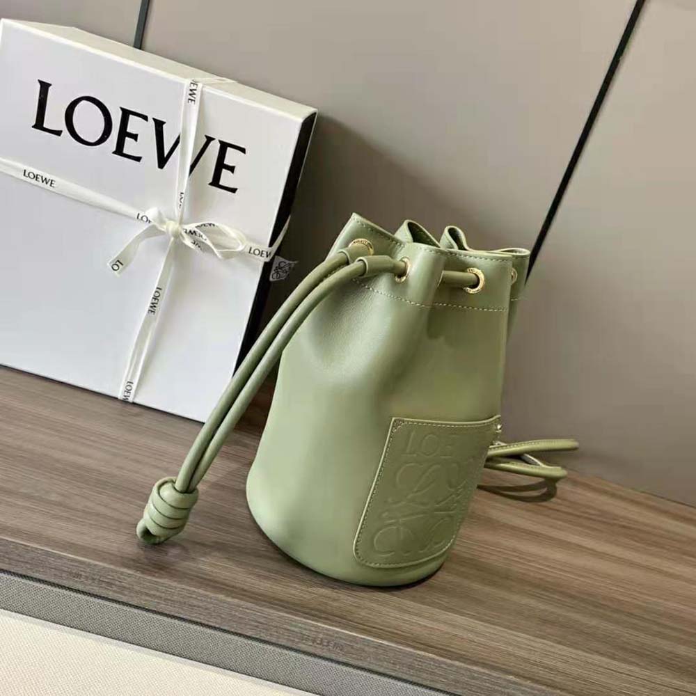 Side angle showing compact silhouette of Loewe Women Small Sailor Bag in Nappa Calf-Lime