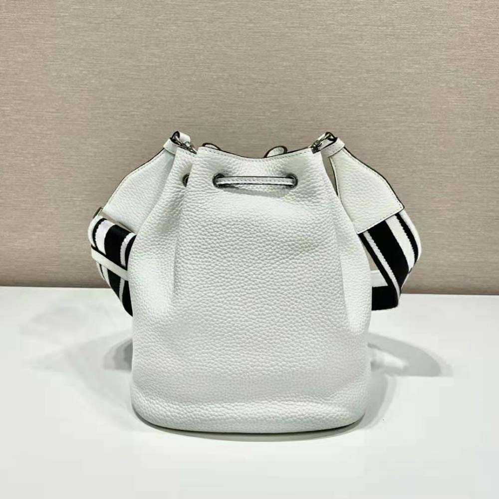 Side angle showing drawstring closure on Prada white leather bucket bag