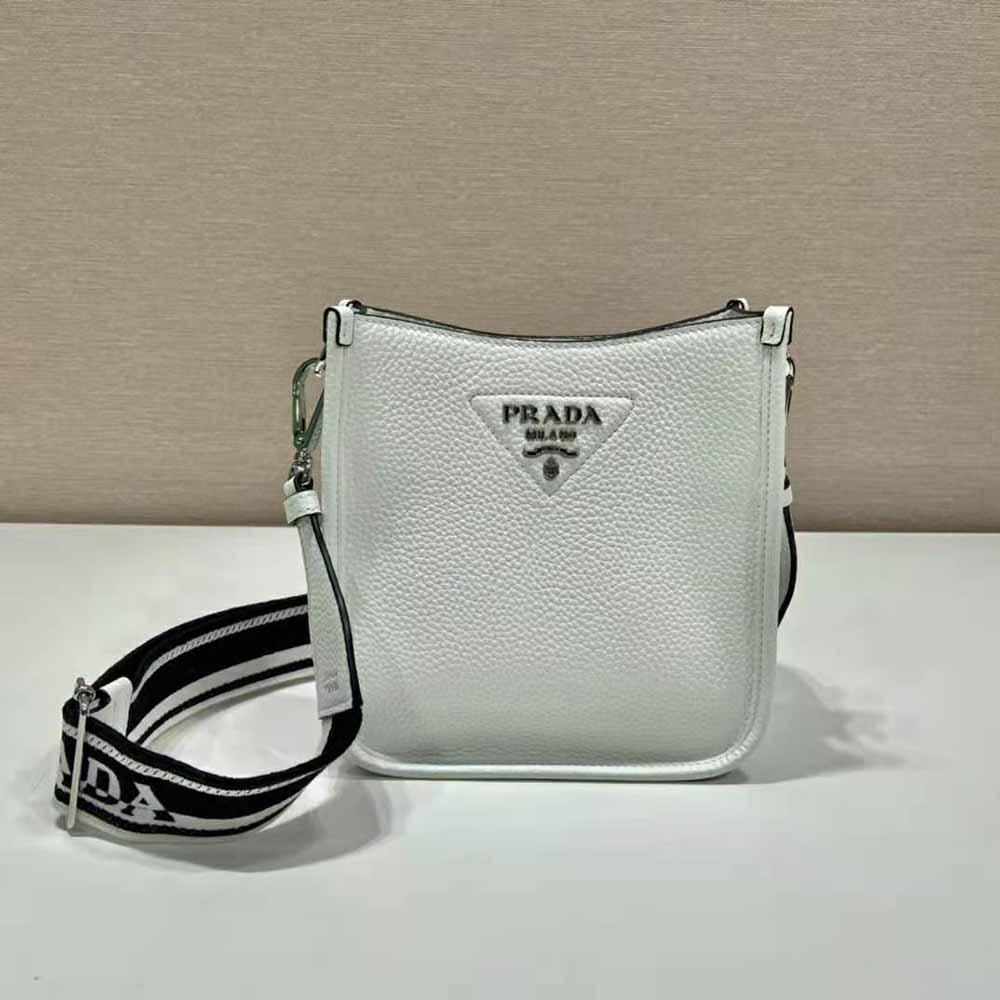 Side angle showing strap and silhouette of Prada Unisex Leather Mini Shoulder Bag-White