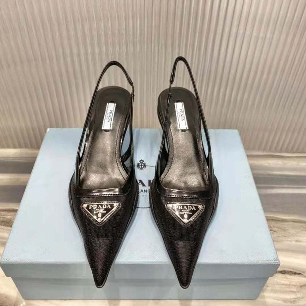 Close-up of black mesh fabric and Prada logo on slingback pumps