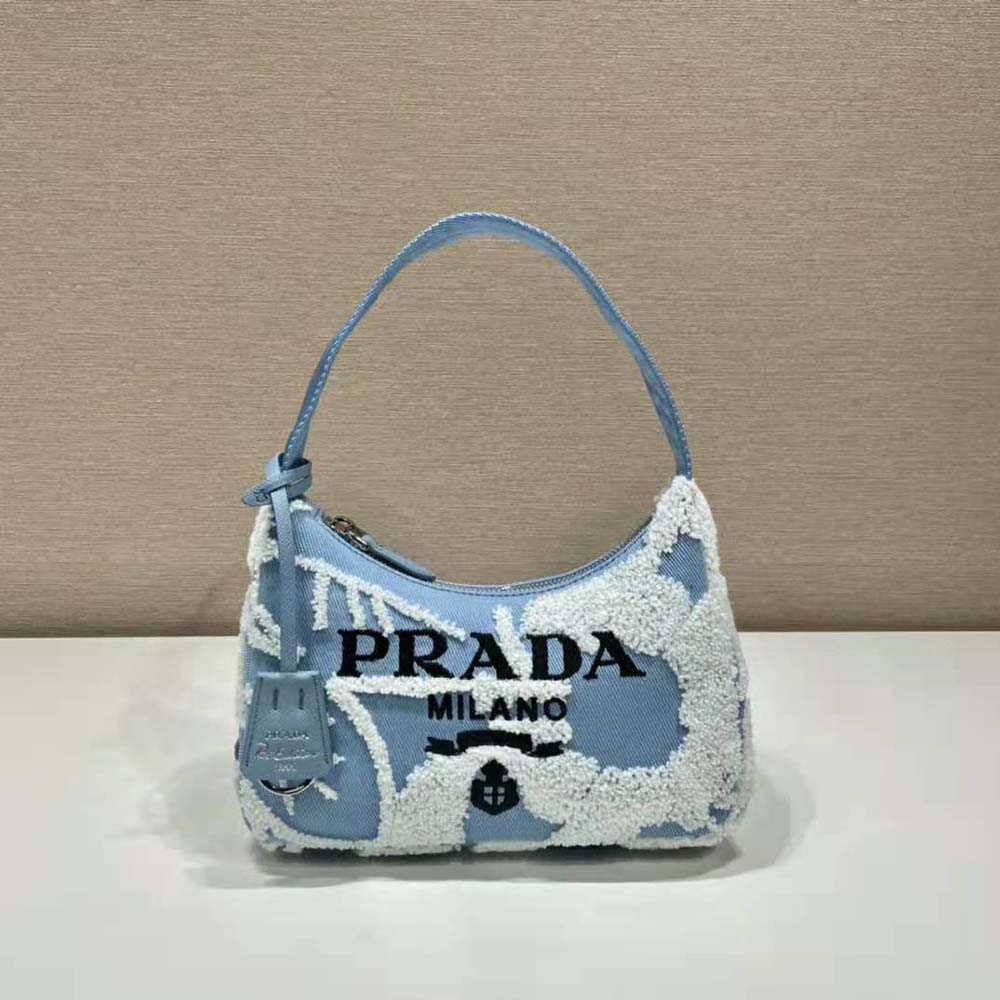 Close-up of embroidered logo and silver hardware on Prada Women Re-Edition 2000 Embroidered Drill Mini Bag-Blue