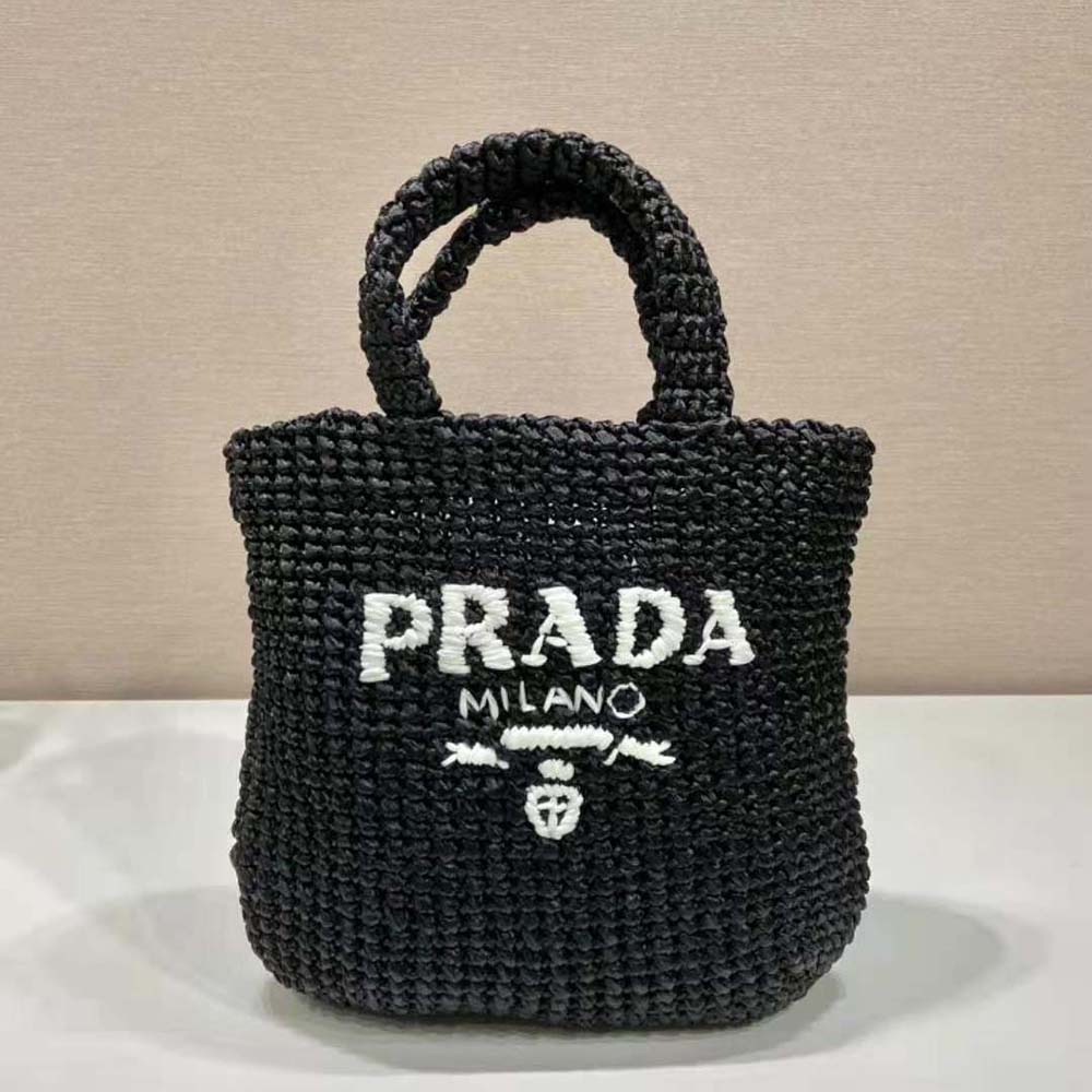 Close-up of gold-tone hardware and Prada logo on Small Raffia Tote Bag-Black
