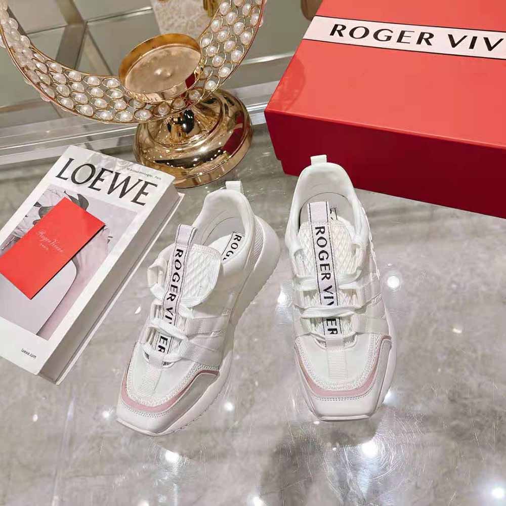 Close-up of lace-up and metallic Roger Vivier logo on white sneakers