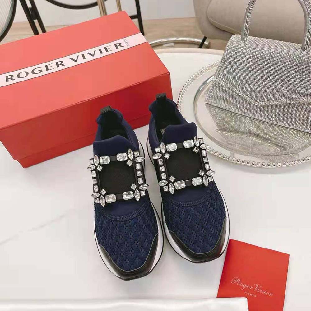 Close-up of crystal strass buckle on navy Roger Vivier sneakers