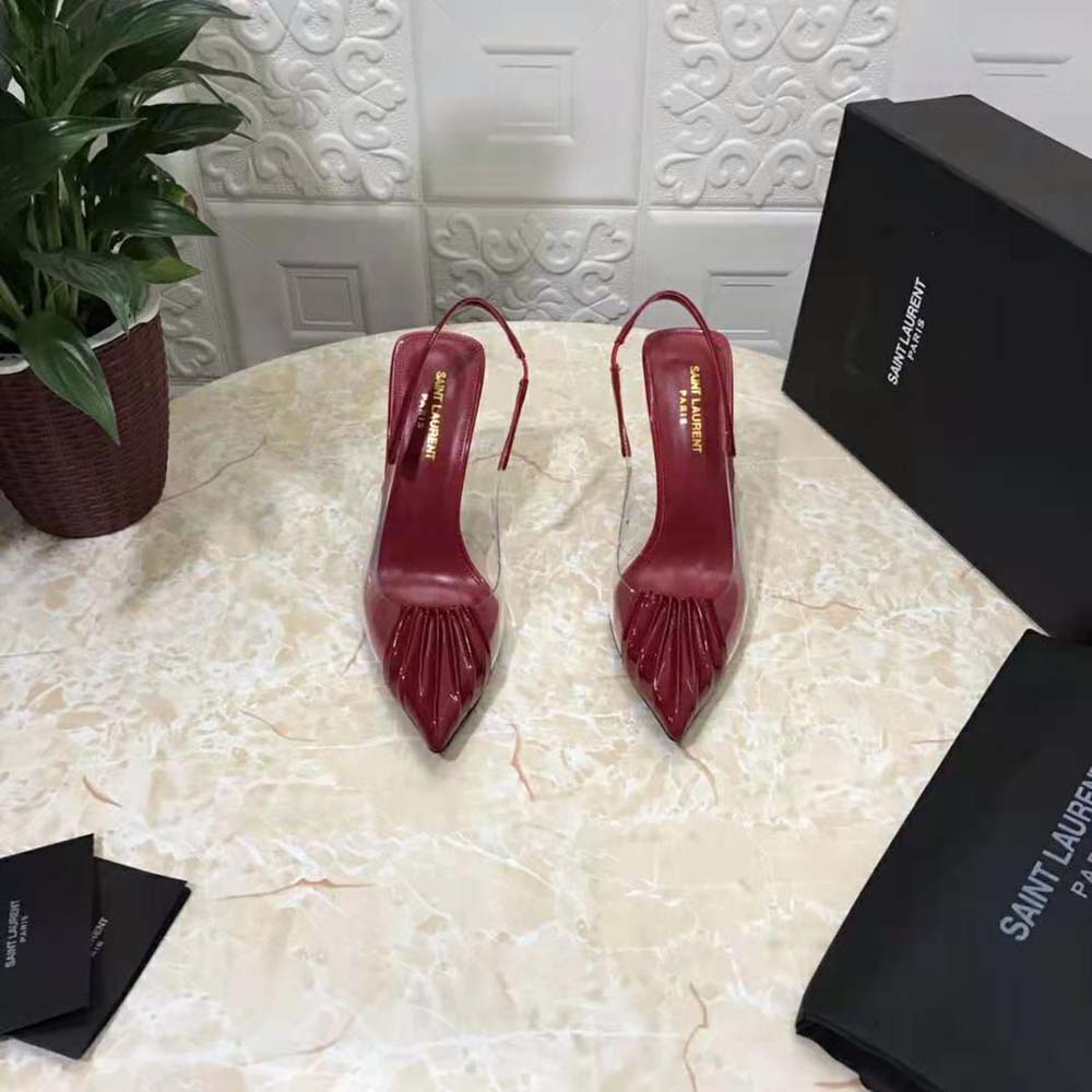 Close-up of signature YSL logo hardware on Chica Slingback Pumps