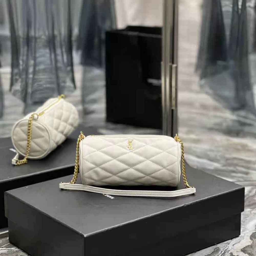 Close-up of quilted lambskin texture and silver YSL logo on mini tube bag