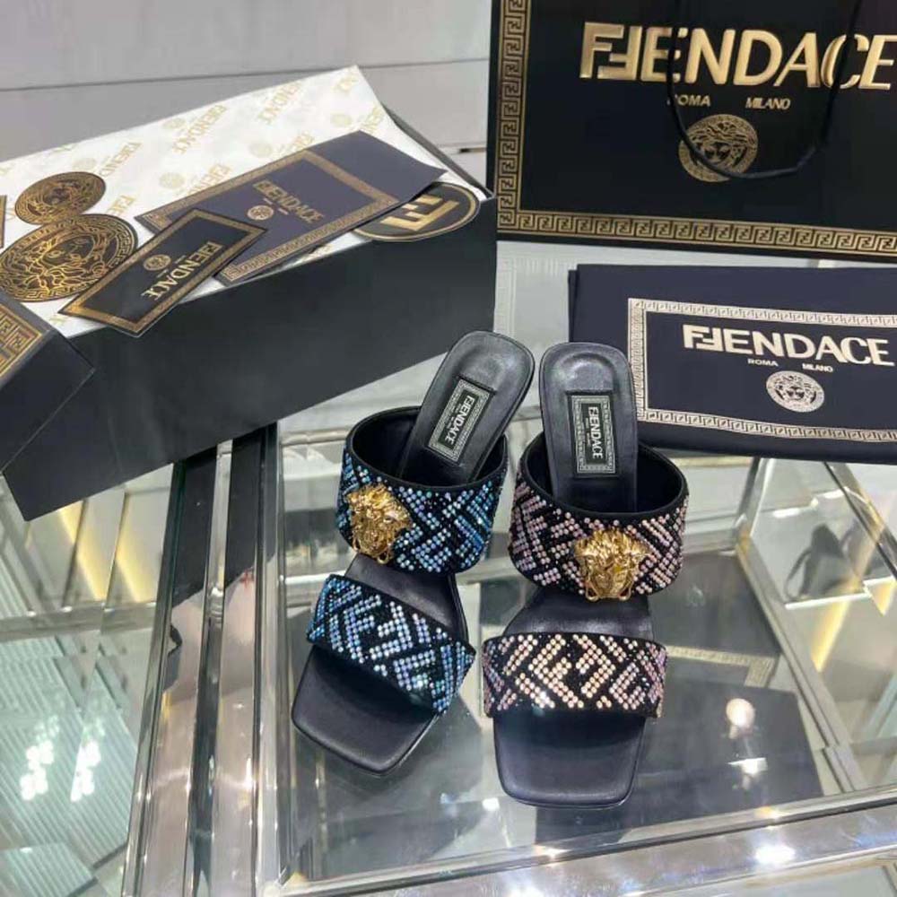 Close-up of gold Medusa hardware on Versace Women Fendace FF Jacquard Mules