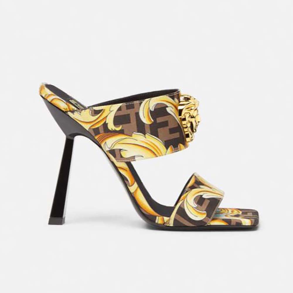 Side profile of Versace Women Fendace Gold Baroque Mules-Black showing gold hardware