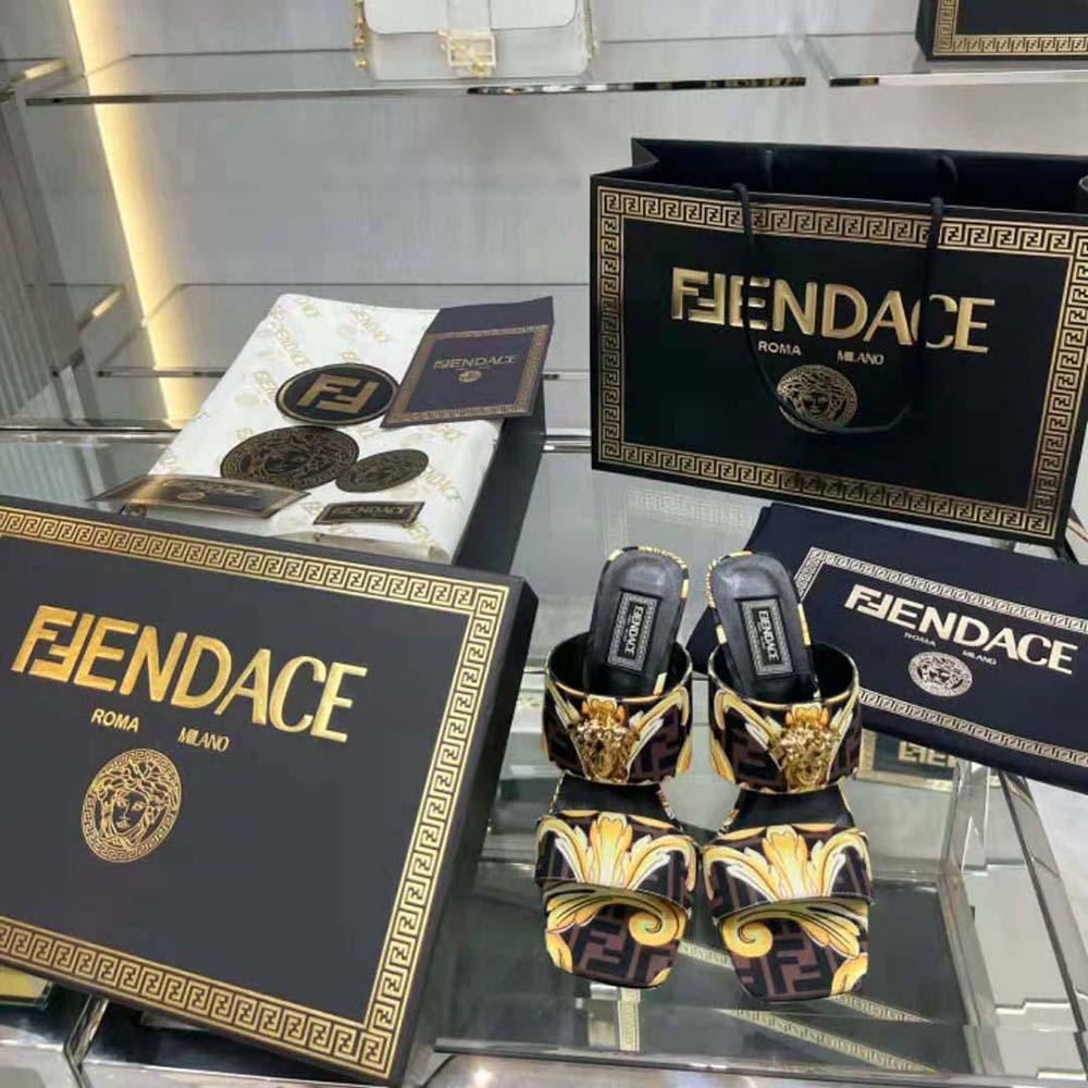 Top view highlighting open-toe design on Versace Women Fendace Gold Baroque Mules-Black
