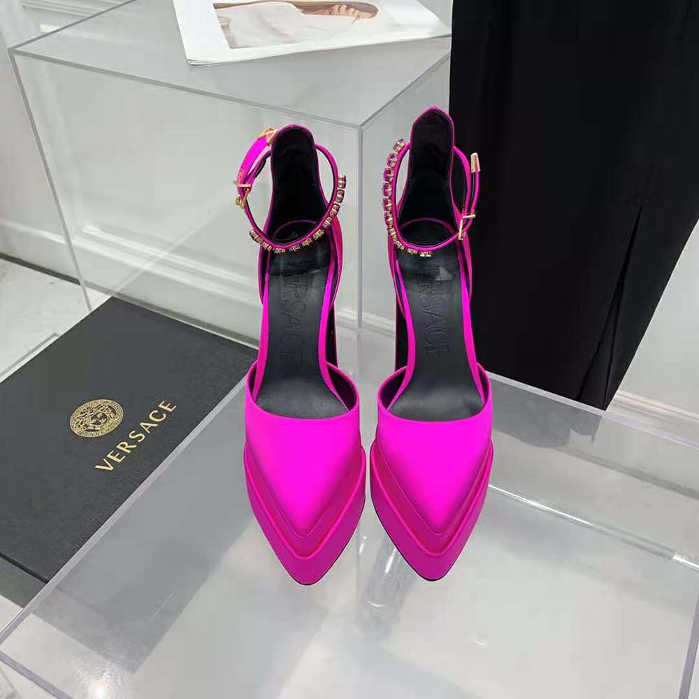 Close-up of gold Medusa hardware on Versace Women Medusa Aevitas Pumps