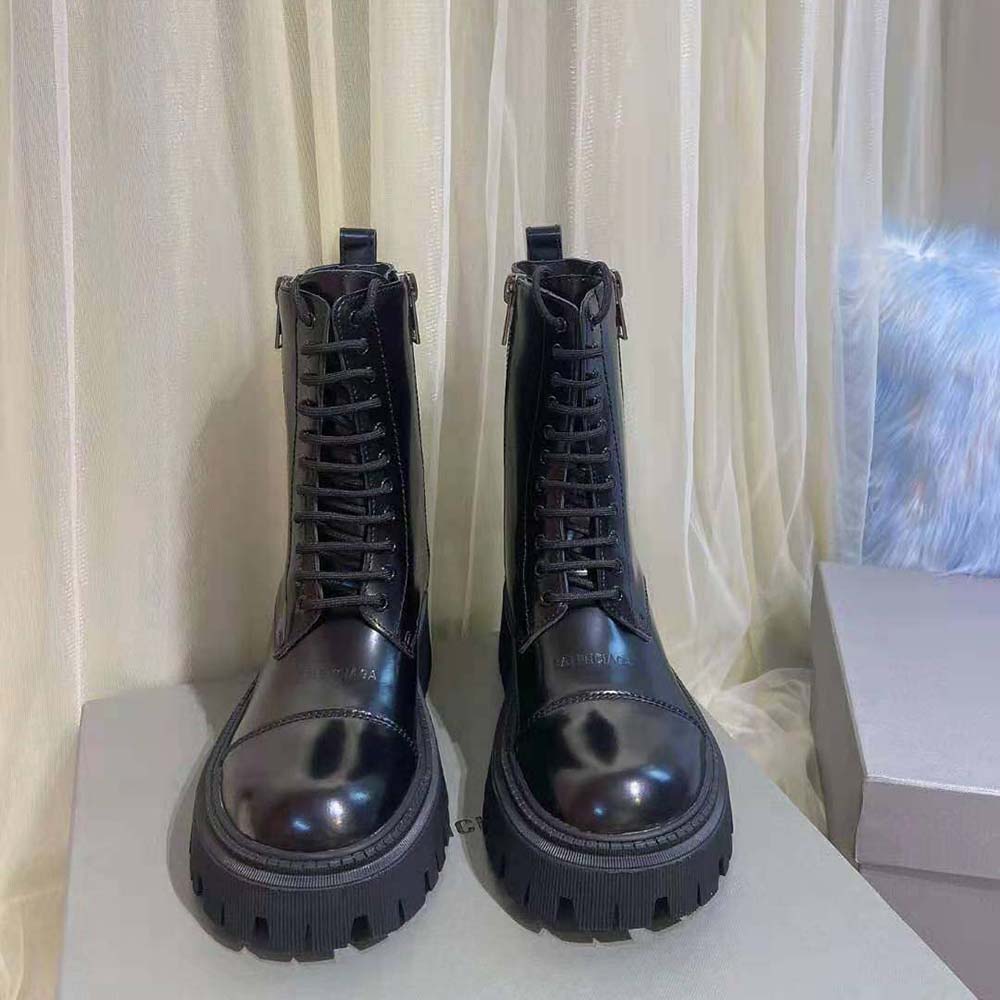 Close-up on lacing and matte black hardware of Balenciaga Tractor Boot