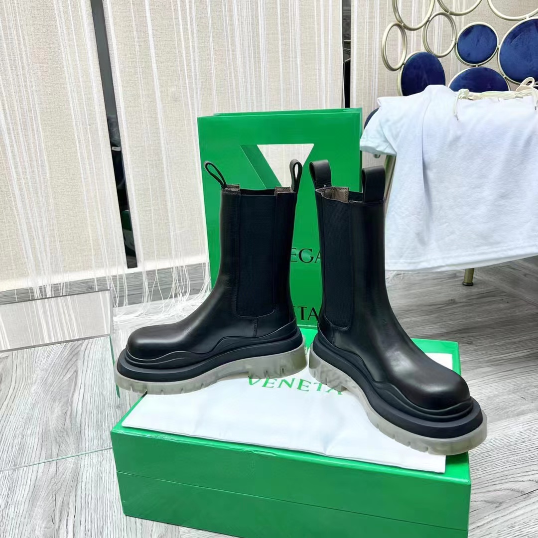 Close-up of lug sole and elastic side panels on the boot
