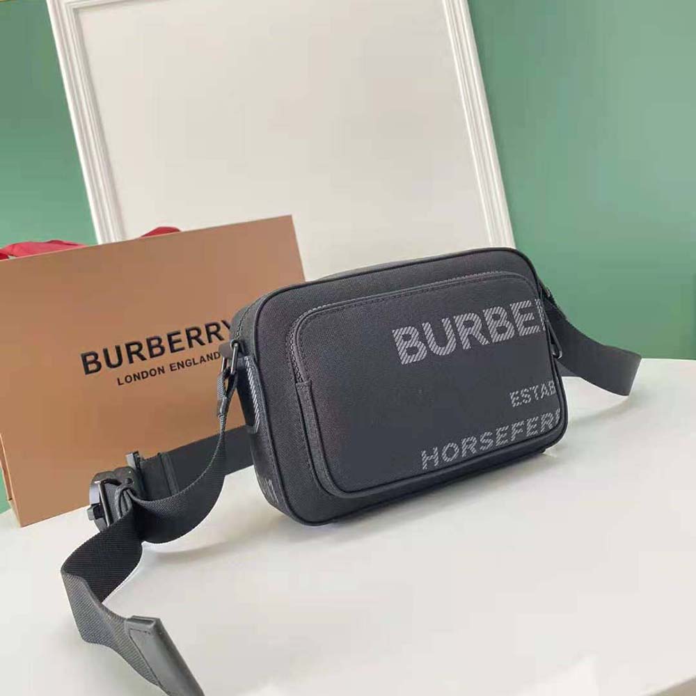 Side angle showing adjustable strap and matte hardware on Burberry crossbody