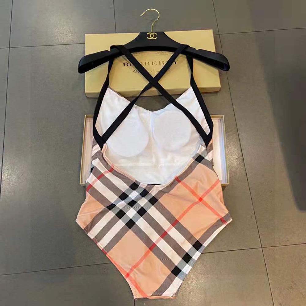 Side angle showing silhouette and stretch fabric of Burberry swimsuit