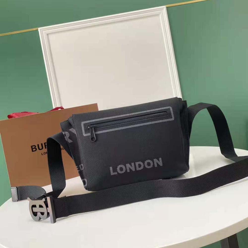 Side profile showing adjustable strap of Burberry Horseferry nylon messenger bag